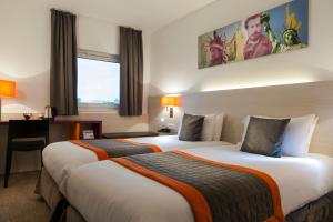 Postel nebo postele na pokoji v ubytování Best Western Colmar Expo