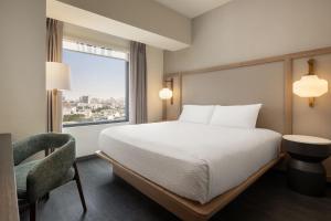 A bed or beds in a room at Fairfield by Marriott Lima Miraflores