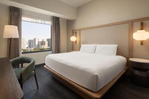 A bed or beds in a room at Fairfield by Marriott Lima Miraflores