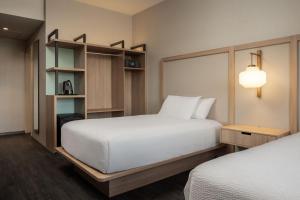 A bed or beds in a room at Fairfield by Marriott Lima Miraflores
