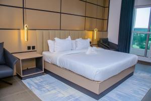 Ein Bett oder Betten in einem Zimmer der Unterkunft G-Pinnacle Signature