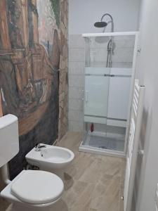 a bathroom with a toilet and a shower at Le colline in Capena