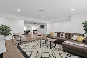 a living room with a couch and a table at Sunlit Serenity in Tempe in Tempe