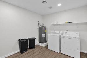 a white laundry room with a washer and dryer at Sunlit Serenity in Tempe in Tempe +28 photos