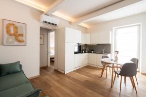 a living room with a couch and a table at CADAMARE charming rooms in Portovenere in La Spezia