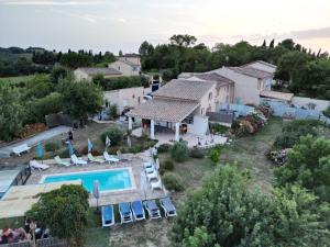 an aerial view of a villa with a swimming pool at Gites Les Granges De Flolie in Beauteville
