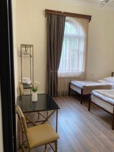 Postel nebo postele na pokoji v ubytování Yan Guest House