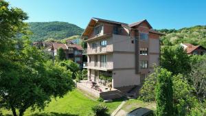 a large building in the middle of a city at Guest House Dimitrije in Niška Banja