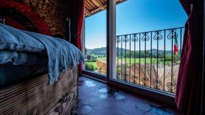 a bedroom with a large window with a view at Panoramic Scenic View da Lusi - Pet Friendly in Cortandone