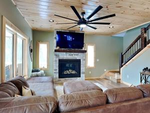 a living room with a couch and a fireplace at Big and Boulder in McHenry