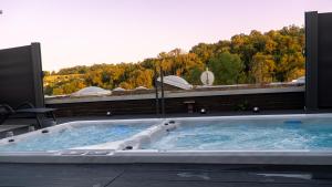 a jacuzzi tub sitting on top of a building at Villafine - Privat, Uneinsehbar! in Vaihingen an der Enz