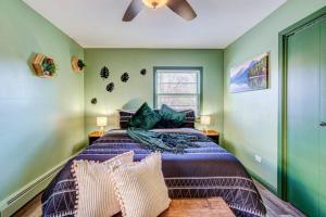 a bedroom with a bed and a ceiling fan at Top Rated Condo - Historic Location in Elmwood Park