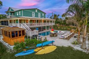 an aerial view of a house with a kayak and a pool at No 1 Largest Tampa Private Compound, 11BR Sleeps 40 in Tampa