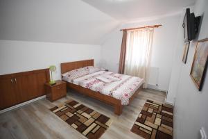 Postel nebo postele na pokoji v ubytování Casa Ion