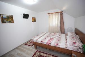 Postel nebo postele na pokoji v ubytování Casa Ion