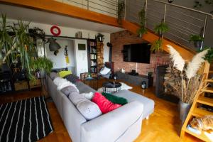 a living room with a couch and a fireplace at Viktorias home in Viskovo
