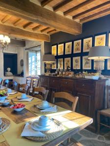 a dining room with a table and chairs at Podere Cavalbianco in Monte San Savino