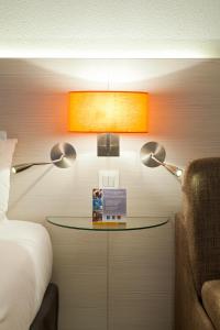 Postel nebo postele na pokoji v ubytování Best Western Colmar Expo
