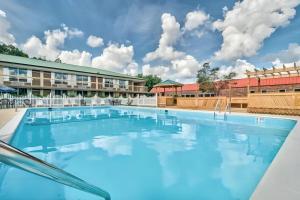 a pool at days inn suites by wyndham greensboroboro airport at Guest Inn Aiken in Aiken
