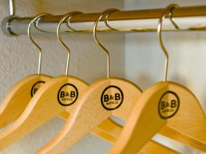 four wooden rackets with the words bkbarma on them at B&B HOTEL La Rochelle Angoulins in Angoulins-sur-Mer