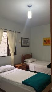 Triana Guest House客房内的一张或多张床位