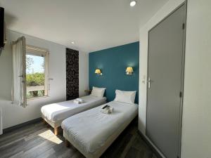 Voodi või voodid majutusasutuse Fasthotel Avignon Nord Le Pontet toas