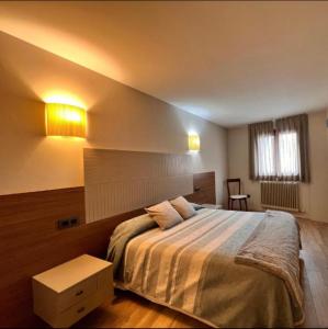 Postel nebo postele na pokoji v ubytování Apartamentos Casa Roldan