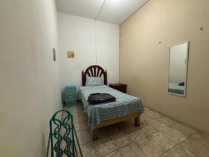 Postel nebo postele na pokoji v ubytování Hostal 509
