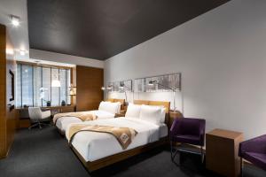 Voodi või voodid majutusasutuse Hotel Le Germain Calgary toas +37 fotot
