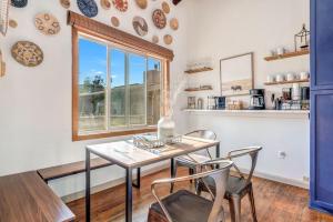 a dining room with a table and chairs and a window at Ski Town Chalet in Steamboat Springs +20 photos
