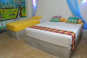 Postel nebo postele na pokoji v ubytování Negombo The Nature Villa and Cabanas