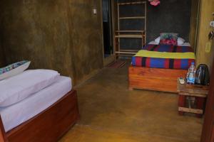 Postel nebo postele na pokoji v ubytování Negombo The Nature Villa and Cabanas