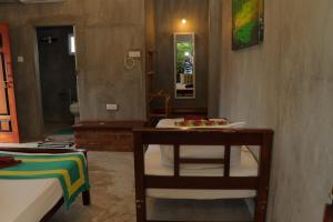 Postel nebo postele na pokoji v ubytování Negombo The Nature Villa and Cabanas