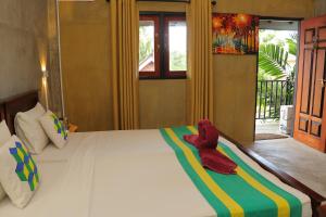 Postel nebo postele na pokoji v ubytování Negombo The Nature Villa and Cabanas