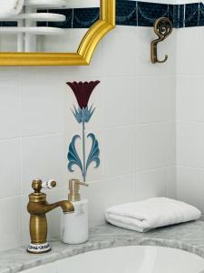 a bathroom sink with a faucet and a towel at Willa Świeradówka in Świeradów-Zdrój +171 photos