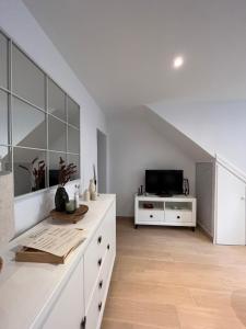 Μια τηλεόραση ή/και κέντρο ψυχαγωγίας στο Apartamento 1 dormitorio - Geraneos 14