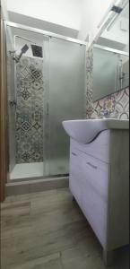 a bathroom with a sink and a shower at Hello Roma B&B in Rome