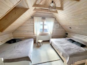Ένα ή περισσότερα κρεβάτια σε δωμάτιο στο GREY PINE HOUSE