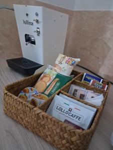 a basket filled with food and other items on a table at La Petite Maison in Naples