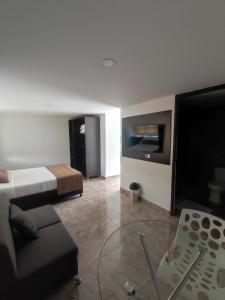 Voodi või voodid majutusasutuse Hotel Palmas De Alcalá toas