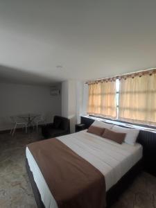 Voodi või voodid majutusasutuse Hotel Palmas De Alcalá toas