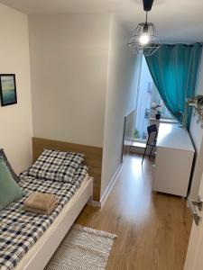 Posteľ alebo postele v izbe v ubytovaní Matejki rooms