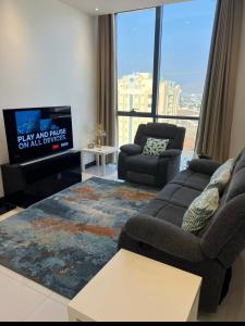 Posezení v ubytování Deluxe Apartment