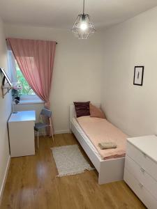 Posteľ alebo postele v izbe v ubytovaní Matejki rooms