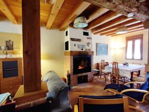 a living room with a couch and a fireplace at Alojamiento Turístico Casa Los Laureles in Segovia