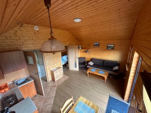 an overhead view of a living room with a couch at Bieszczady Pod Dębem Solina in Solina