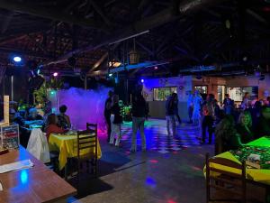 a group of people on a stage at a party at Ananda pousada chalé in São Pedro +157 photos