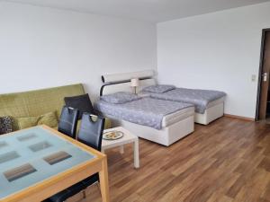 En eller flere senge i et værelse på B1011, gemütliches Appartement mit Ausblick