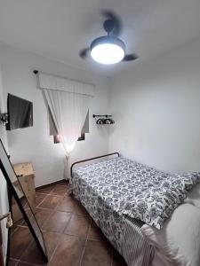 Ένα ή περισσότερα κρεβάτια σε δωμάτιο στο Casa Cabello