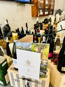 a bunch of bottles of wine on a table at Hotel Paradiso in Celano